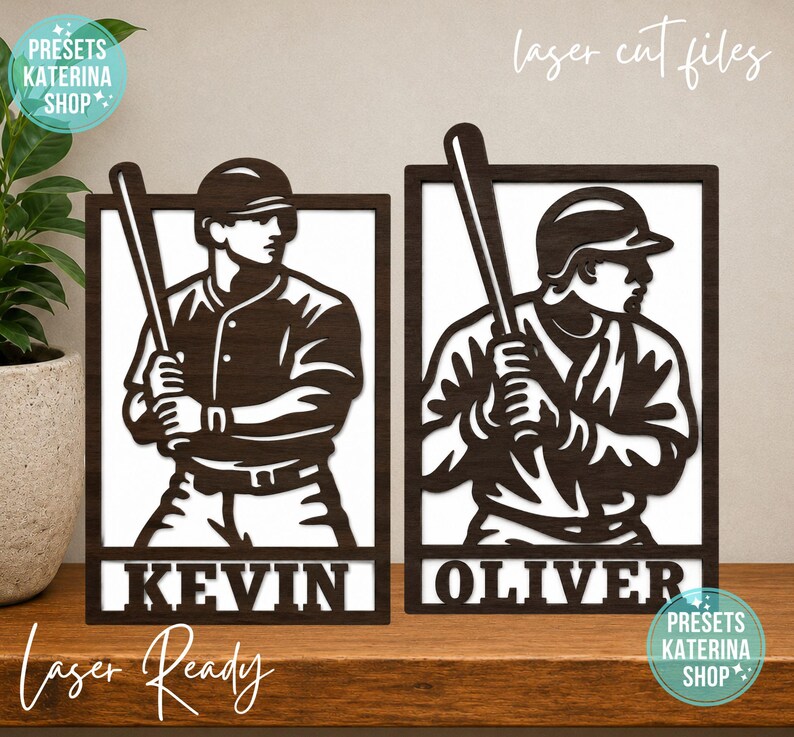 May include: Two rectangular dark brown laser-cut wooden signs featuring baseball players holding bats. Each sign has a white background and displays a name at the bottom, with the left sign reading KEVIN and the right sign reading OLIVER.
