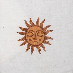The sun embroidered design, the sun face embroidery design