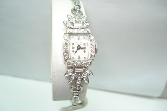 Geneva platinum watch with diamonds sales