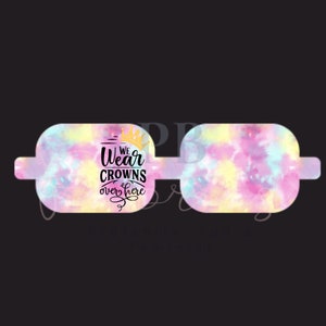 May include: A pair of pink and yellow tie-dye glasses with a gold crown and the text "We Wear Crowns Over Here".