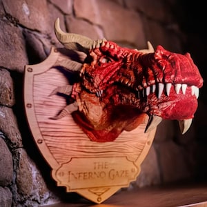 May include: A red dragon head mounted on a wooden plaque with the text "The Inferno Gaze".