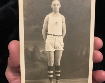 Antique post card RPPC, (unused) of man in an athletic uniform/outfit.