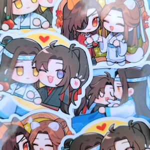 May include: A selection of vibrant stickers showcasing chibi-style illustrations of two characters. The characters have dark hair and wear traditional clothing in white, black, and red. Some stickers include a heart symbol. The stickers are suitable for various uses.