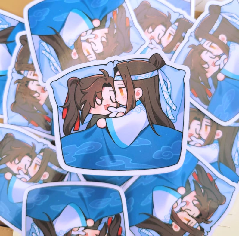 May include: A selection of stickers depicting an anime-style illustration of two characters cuddling in bed. The stickers are predominantly blue and white, with brown-haired characters. The image has a cartoonish aesthetic.