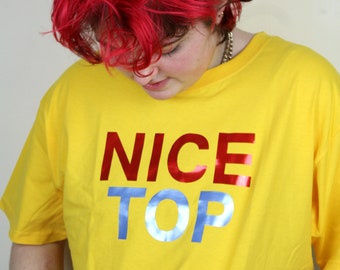 NICE TOP, graphic t-shirt/tee shirt, yellow short sleeve, bright, fun, queer fashion