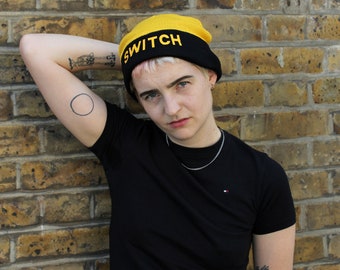 Reversible SWITCH BEANIE, graphic beanie hat, black and yellow, bright, fun, queer fashion