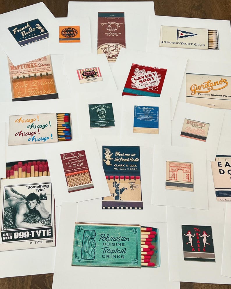 May include: A collection of vintage matchbook cover prints featuring various designs, including Chicago-themed graphics, restaurant advertisements, and retro illustrations. Each print displays unique typography, colorful logos, and iconic imagery from mid-century matchbooks.