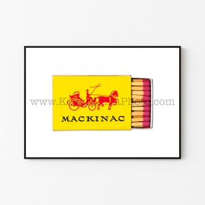May include: A yellow matchbox with a red and black illustration of a horse-drawn carriage and the text "MACKINAC".