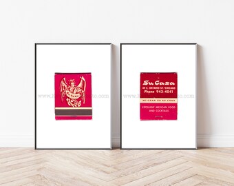 May include: Two framed prints of vintage matchbook covers. The left print features a red matchbook cover with a gold angel illustration and the text "Su Casa". The right print features a red matchbook cover with the text "Su Casa 49 E. Ontario St-Chicago Phone 943-4041 Mi Casa Es Su Casa Excellent Mexican Food and Cocktails".