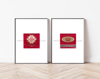 May include: Two framed vintage matchbook covers. The left matchbook cover is red with gold lettering and says "The Steak Joint" with the address "619 North Wells St. Old Town Chicago". The right matchbook cover is red with gold lettering and says "Featuring Prime Aged Steaks".