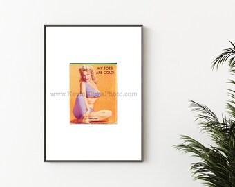 May include: A vintage illustration of a woman in a purple swimsuit with the text "My toes are cold!" and the website address "www.KevinKlimaPhoto.com".