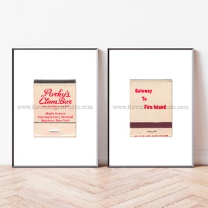 May include: Two framed prints featuring vintage matchbooks. One reads "Porky's Clam Bar" in red script, the other says "Gateway To Fire Island" in red. Both have black frames and are set against a white background.