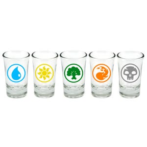 May include: Set of five clear glass shot glasses with different colored Magic: The Gathering symbols. The symbols are water, fire, earth, air, and black.