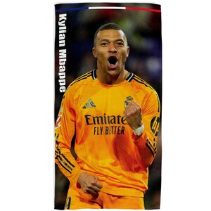 May include: A rectangular towel with a picture of Kylian Mbapp&eacute; in a yellow football jersey. The towel has the text "Kylian Mbappe" vertically on the left side and a French flag design at the top. The jersey has the text "Emirate Fly Better".