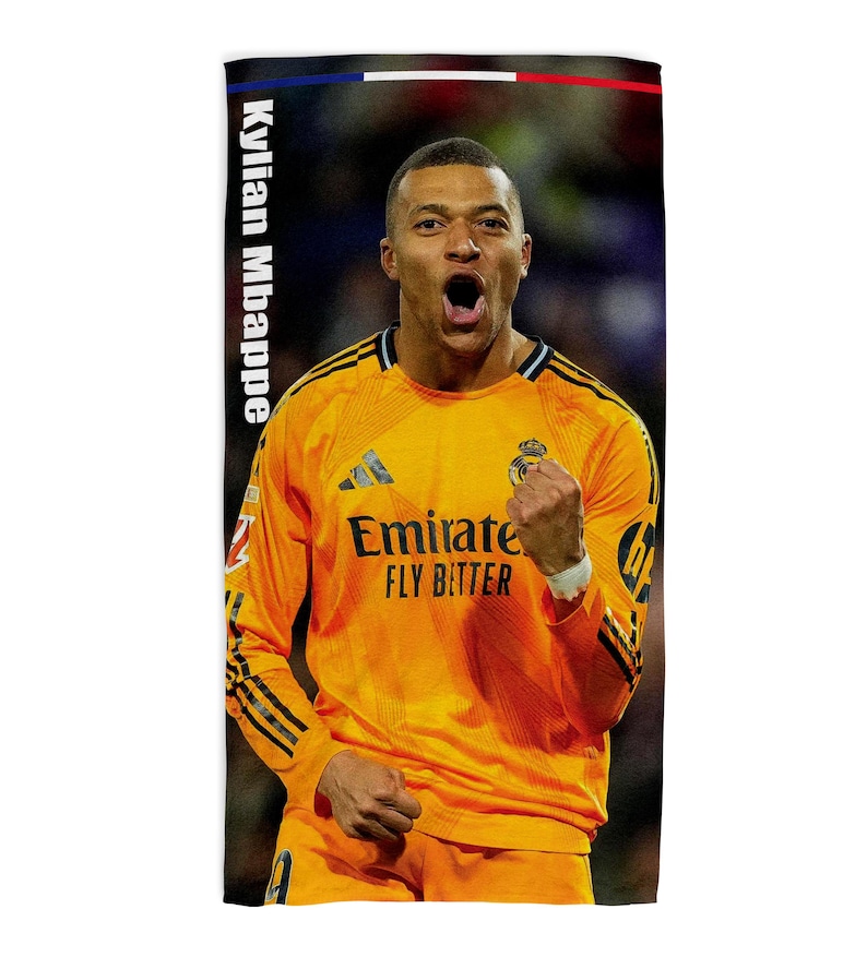 May include: A rectangular towel with a picture of Kylian Mbapp&eacute; in a yellow football jersey. The towel has the text "Kylian Mbappe" vertically on the left side and a French flag design at the top. The jersey has the text "Emirate Fly Better".