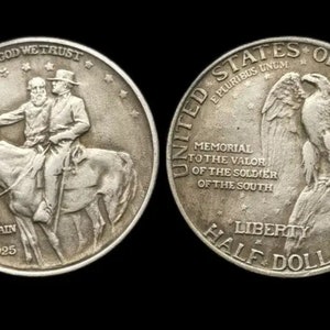 May include: A silver half dollar coin commemorating the valor of the soldiers of the South. The obverse features a portrait of two men on horseback, with the inscription "Stone Mountain 1925". The reverse features a bald eagle perched on a rock, with the inscription "United States of America, Memorial to the Valor of the Soldier of the South, Liberty Half Dollar Copy".