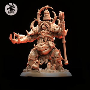 May include: A detailed, beige-colored miniature figure of a monstrous warrior with horns, armor, and a bell. The figure is holding a staff and has a smaller creature at its feet. The logo for "Tainted Windmill" is in the upper left corner.