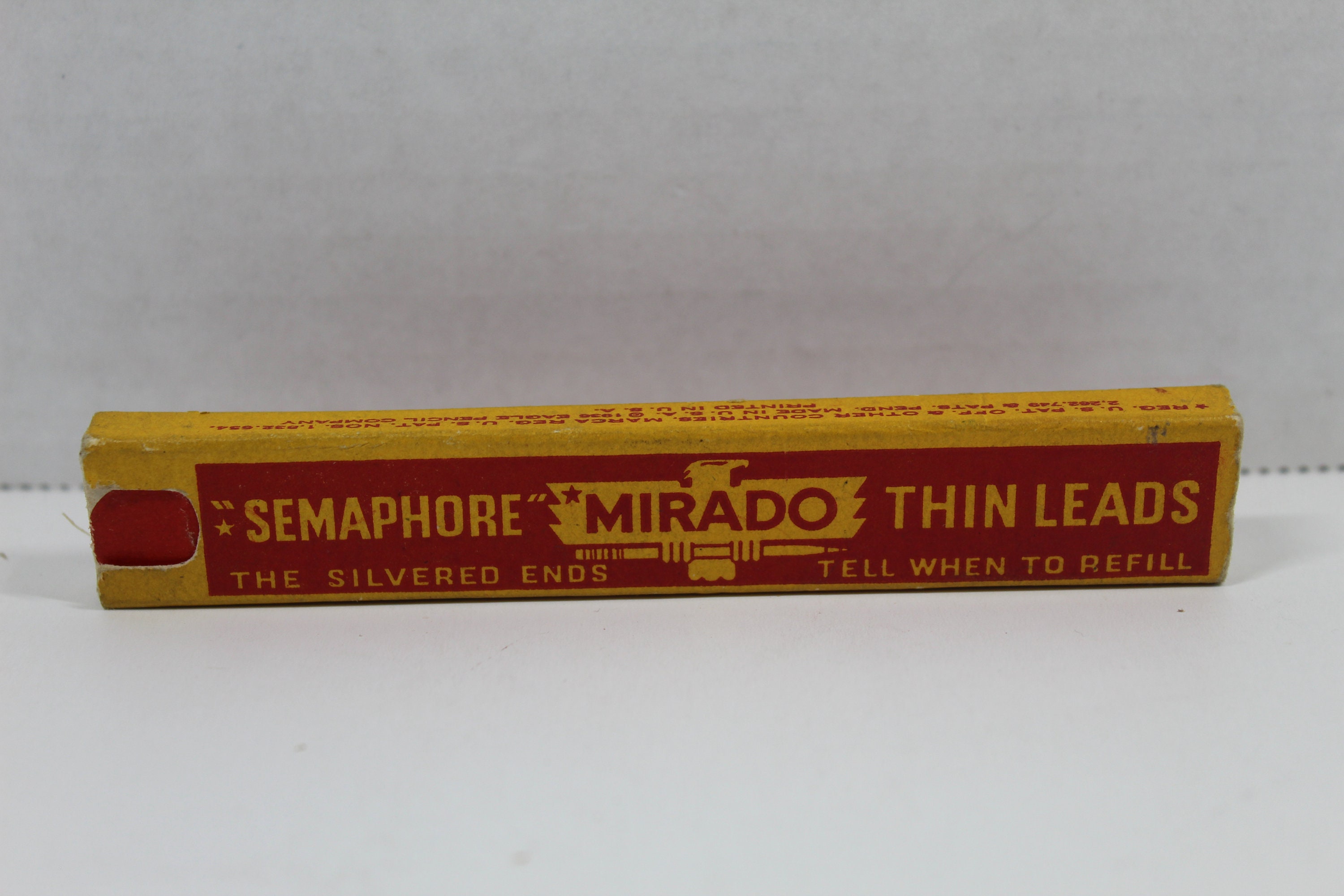 Vintage Semaphore Mirado Thin Leads Eagle Snap in Erasers 1936 on PopScreen