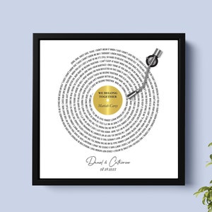 May include: A white vinyl record with black text, a gold record label with the text "We Belong Together" and the artist "Mariah Carey", and the names "Daniel & Catherine" and the date "08.09.2023".