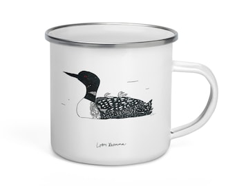 May include: White enamel mug with a black and white illustration of a loon with chicks on its back. The text "Loon Momma" is printed below the illustration.