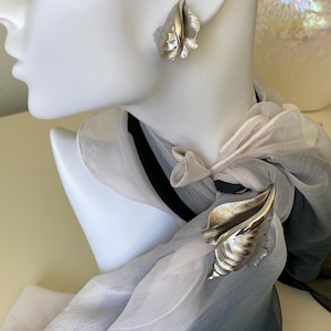 Vintage Crown Trifari conch shell brooch and earring set silver tone
