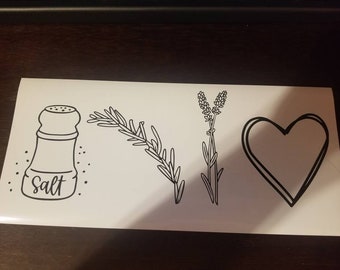 May include: Black and white line art design featuring a salt shaker labeled "Salt", a sprig of rosemary, a sprig of lavender, and a heart.