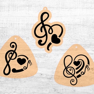 May include: Three wooden ornaments with a black treble clef and heart design. The ornaments are shaped like a circle, a triangle, and a teardrop.