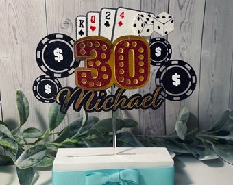 May include: A 30th birthday cake topper featuring a red and gold 30, playing cards, dice, and poker chips. The topper also includes the name Michael.