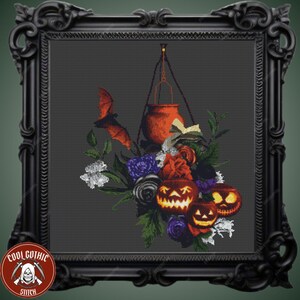 May include: A cross-stitch pattern featuring a cauldron hanging from a chain, surrounded by a bouquet of flowers, bats, and jack-o'-lanterns. The background is a dark grey.
