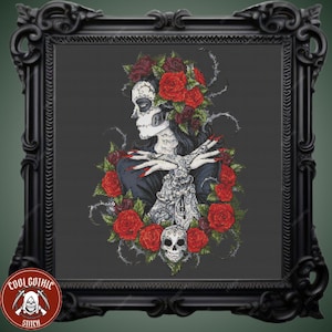 May include: A black and white cross stitch pattern of a woman with a sugar skull face surrounded by red roses and thorns. The woman is wearing a black dress and has long black hair. The background is a dark gray.