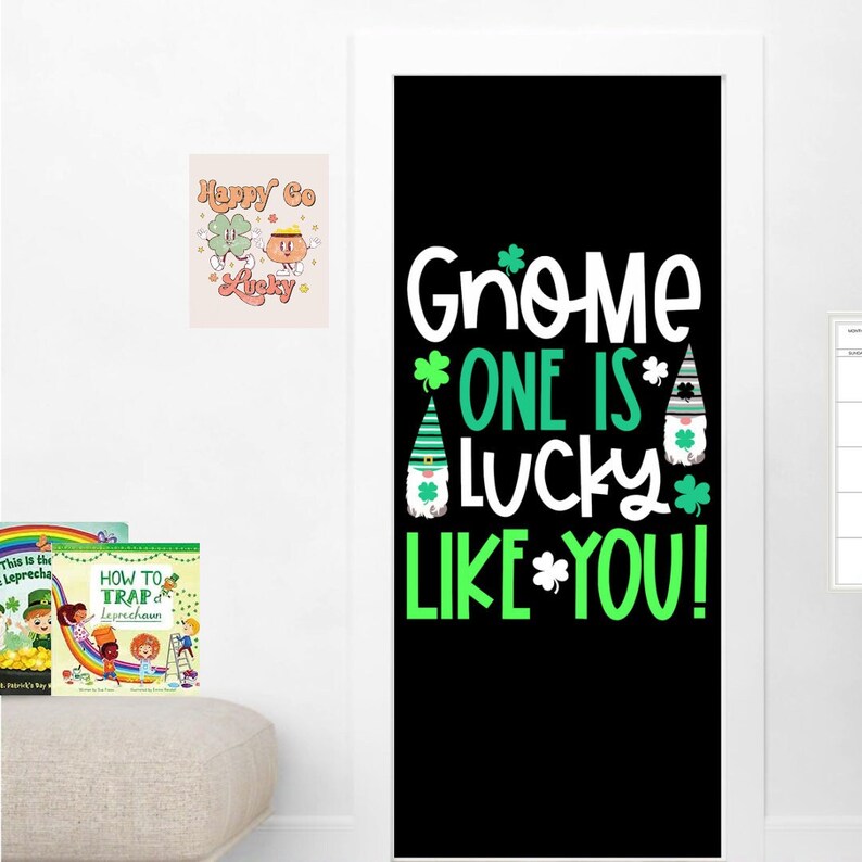 May include: A black door with a green and white sign that says "Gnome One Is Lucky Like You!" with a gnome illustration. There are two books and a picture on the wall next to the door.