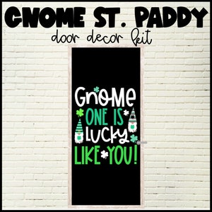 May include: A black door sign with a white frame, featuring a gnome-themed St. Patrick's Day design. The text reads "Gnome One Is Lucky Like You!" with green shamrocks and gnomes.