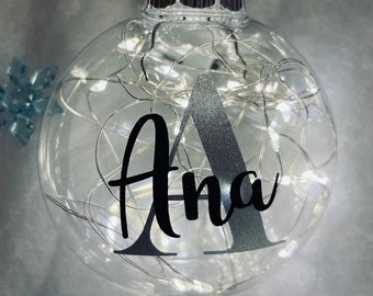 Personalized ornaments with fairy lights.