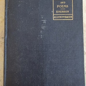 May include: A black hardcover book with gold lettering on the spine. The title is "Select Essays and Poems" by Emerson, published by Allyn and Bacon. The book is part of the Academy Classics series.