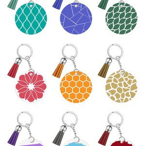 May include: A collection of keychains with silver rings and tassel accents. The round pendants feature various designs, including geometric patterns, floral motifs, and personalized text. Colors include teal, blue, green, red, orange, and brown.
