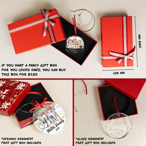 May include: A red rectangular gift box with a silver ribbon, containing a circular glass ornament with a family photo and the text 'heaven'. A second red box measures 200 mm by 120 mm. Includes a ceramic ornament with a family photo and a glass ornament.