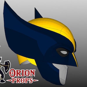 May include: A Wolverine-style mask in yellow and navy blue, with pointed ear-like extensions. The mask has a stylized design with a visible eye and mouth area. The logo "ORION PROPS" is visible in the lower left corner.