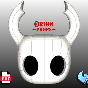 Puede incluir: Una máscara blanca estilizada con grandes agujeros negros para los ojos y dos cuernos curvos. La máscara tiene un diseño segmentado y el texto "ORION PROPS" en rojo. Un icono PDF y un icono de recorte de papel están en las esquinas inferiores.
