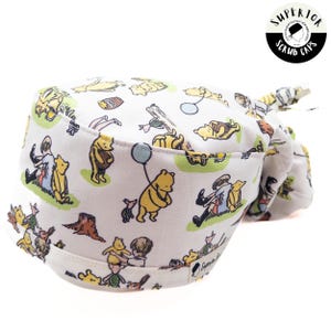 Winnie de Pooh-scrubmuts: stijlen met paardenstaart en kalotje, optie satijngevoerd, striksluiting aan de achterkant
