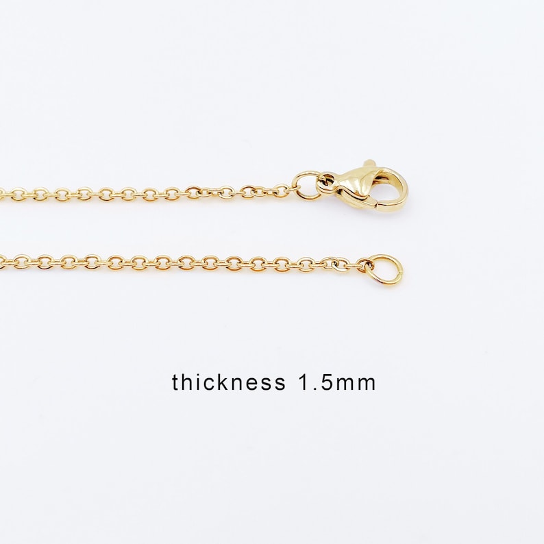 May include: A gold chain necklace with a lobster clasp and a jump ring. The chain is 1.5mm thick.