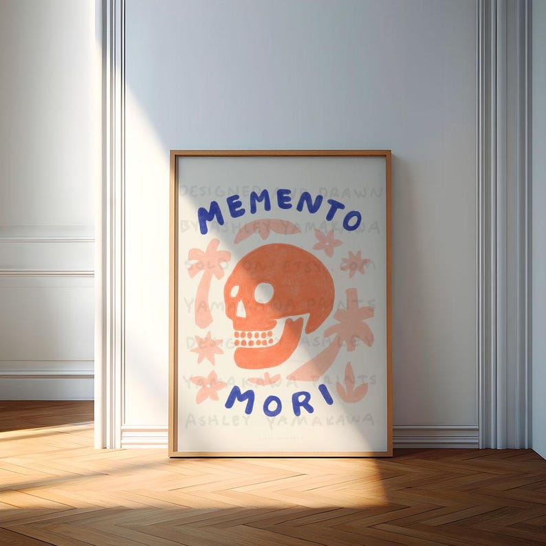 May include: A white poster featuring a pink skull and blue text that reads "Memento Mori". The skull is surrounded by pink palm trees and flowers.