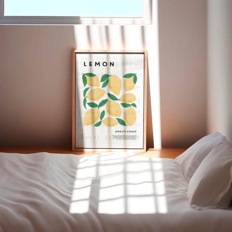 May include: A framed print with a white background and the word "LEMON" in black text. The print features a stylized illustration of lemons with green leaves. The text "Amalfi Coast" is at the bottom of the print.