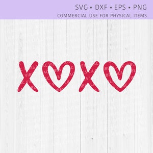 May include: A red graphic design of the letters "XOX" with the "O" being a heart shape. The design is on a white wood background.