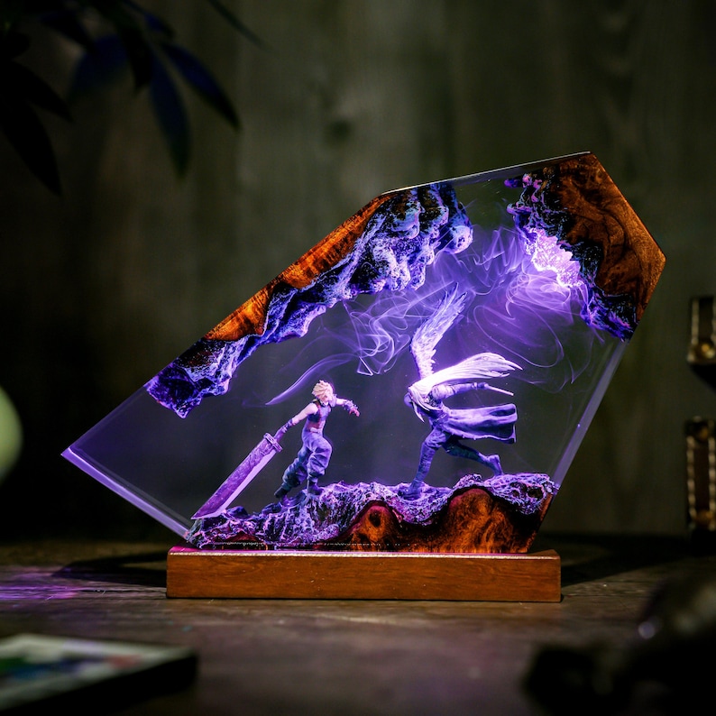 May include: A decorative resin sculpture featuring a battle scene with two figures, illuminated by purple light. The sculpture has a wooden base and a clear, angled resin body with wood and purple accents. The figures are in a fighting pose.