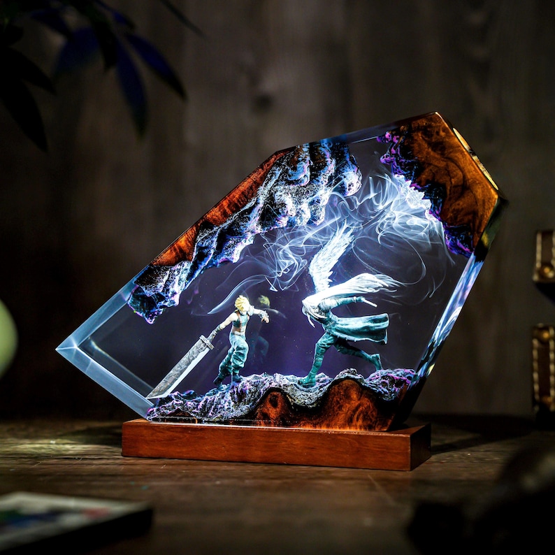May include: A decorative resin sculpture featuring a battle scene with two figures, one holding a large sword. The sculpture is encased in a clear resin with a wooden base and accents. The resin has a blue and brown marbled effect.