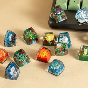 May include: A collection of 12 colorful resin keycaps featuring various nature-inspired designs. Each keycap is a unique piece of art with intricate details and vibrant colors. The keycaps are perfect for adding a touch of personality to any keyboard.