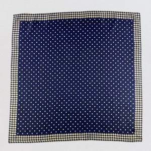 May include: A navy blue square handkerchief with a white polka dot pattern and a white and beige houndstooth border.