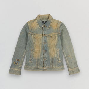 May include: A rustic wooden sign with the text "Welcome to our home" in white lettering. The sign features a distressed finish and a simple, inviting design, perfect for a front porch or entryway.