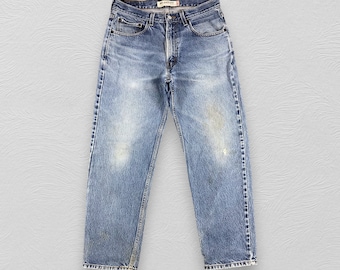 May include: A pair of light blue denim jeans with a faded look. The jeans have a straight leg and a relaxed fit.