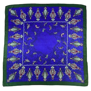 May include: A square blue silk scarf with a paisley pattern in shades of green, burgundy, and white. The scarf has a dark green border.